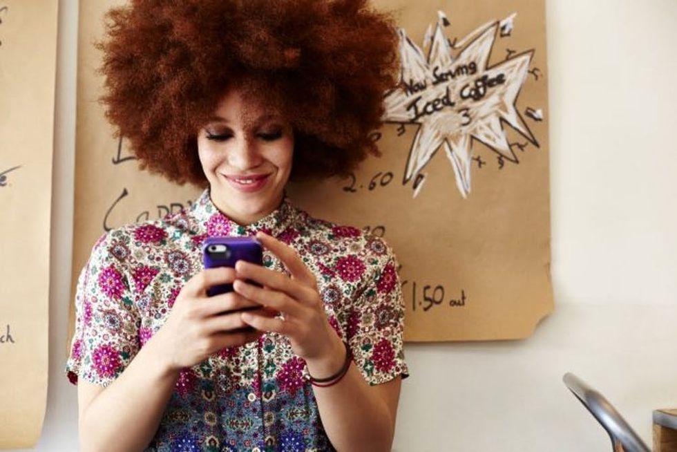 woman on phone in cafe