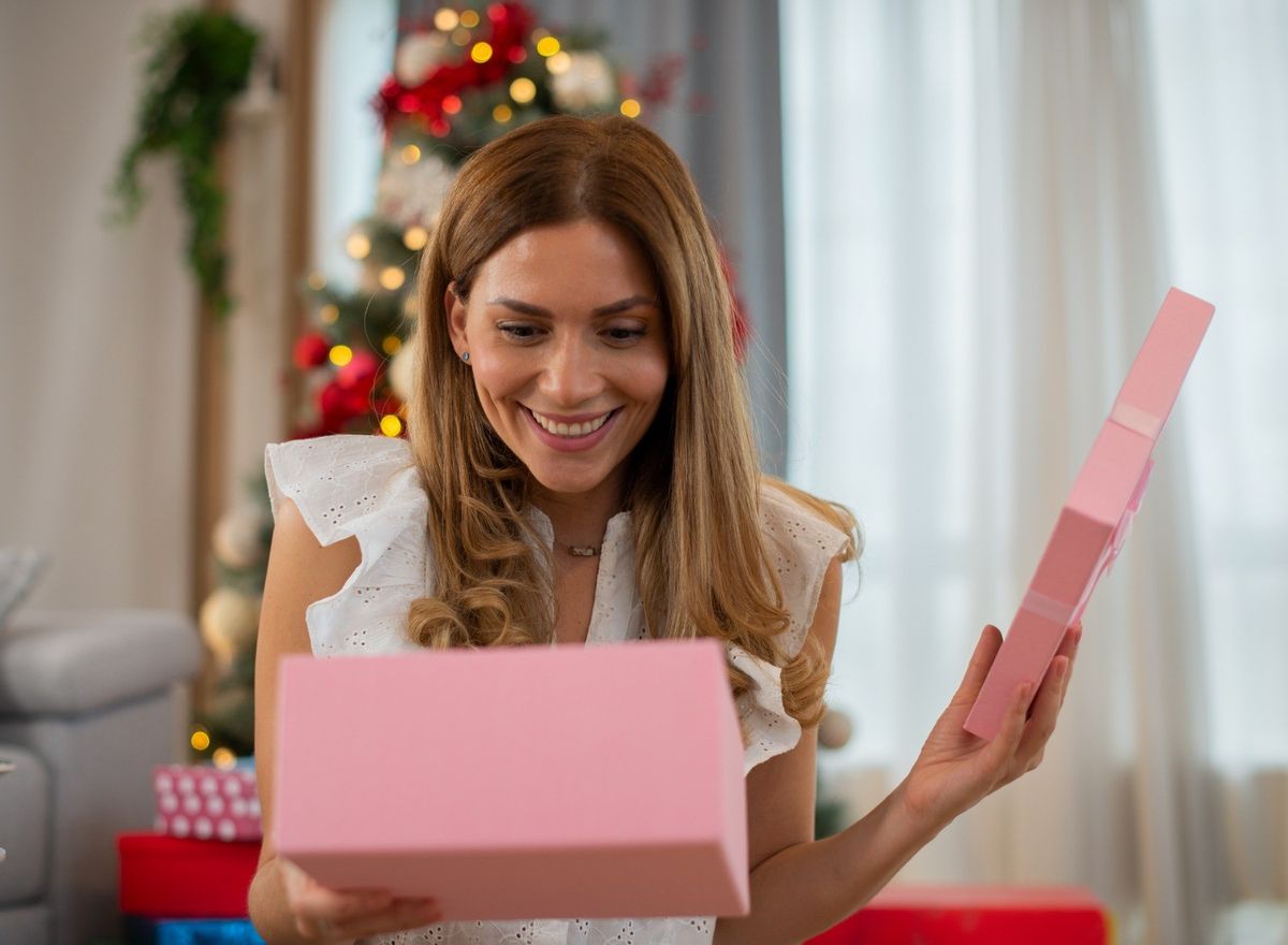 woman-opening-a-christmas-gift