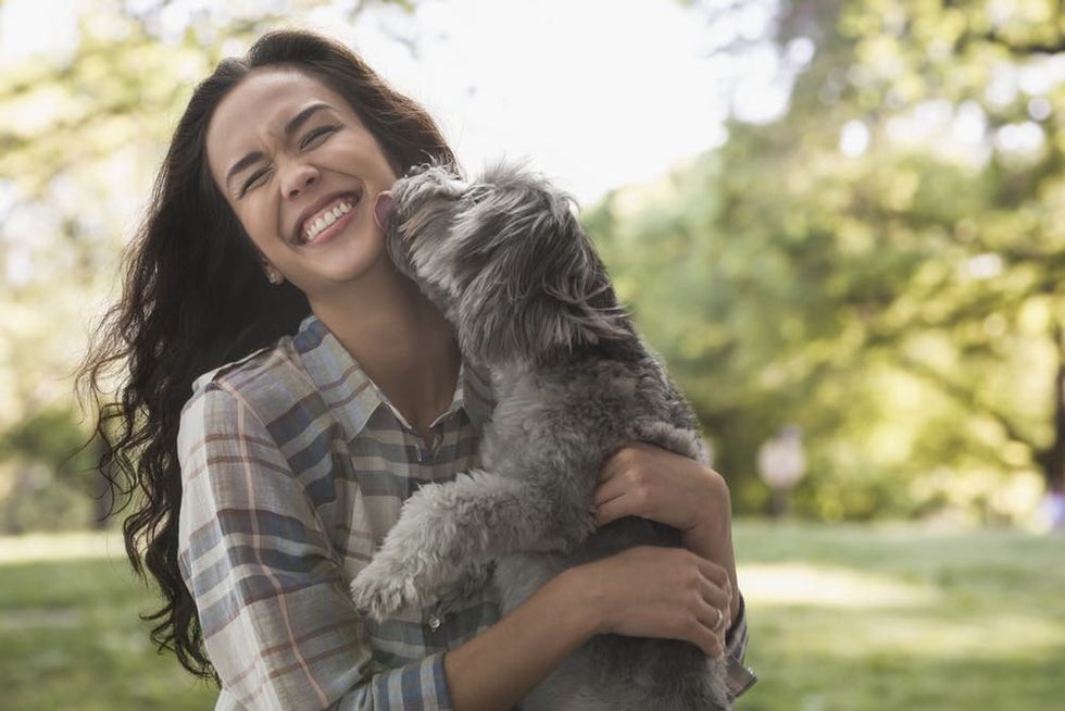 Woman playing with dog