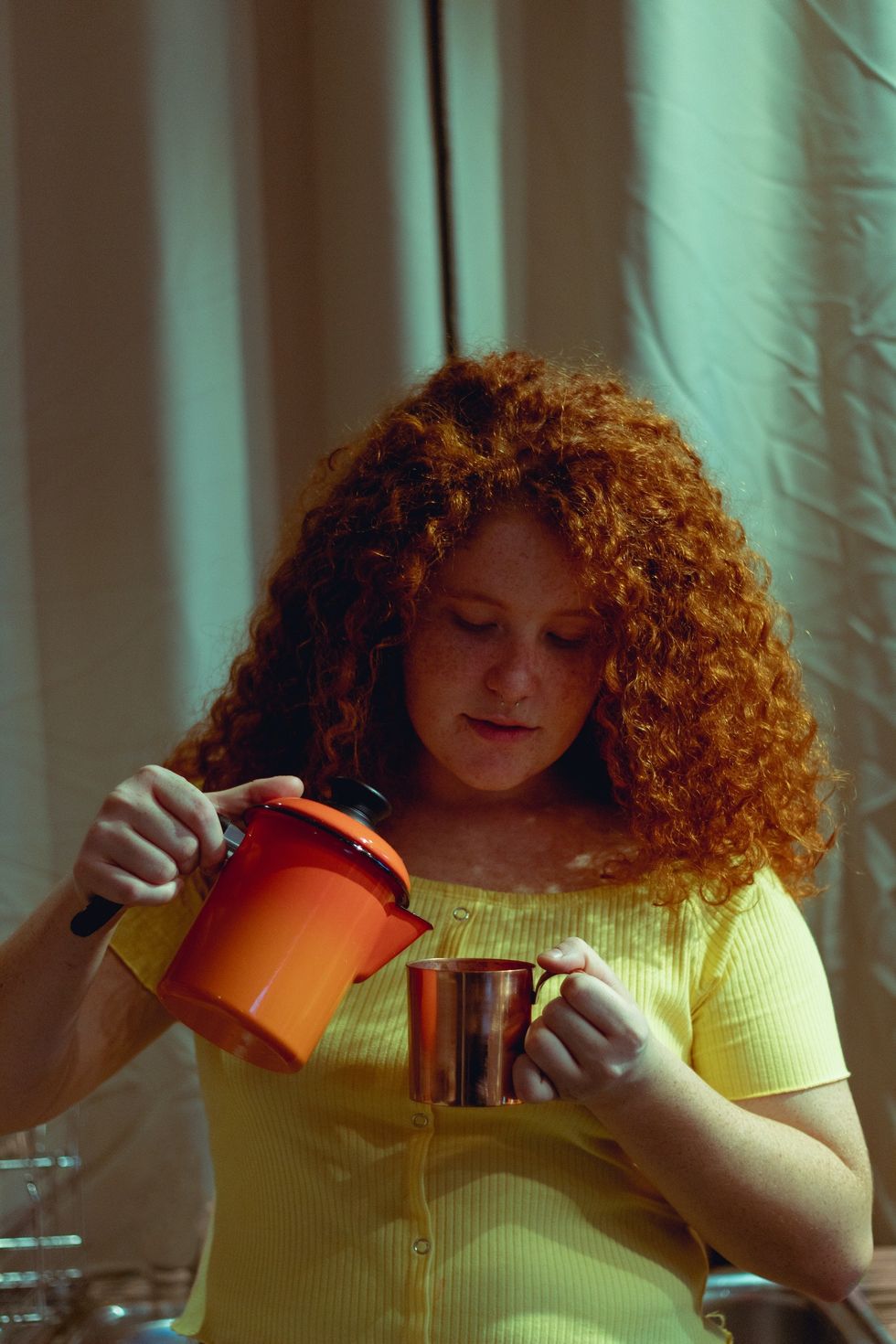 woman pouring tea