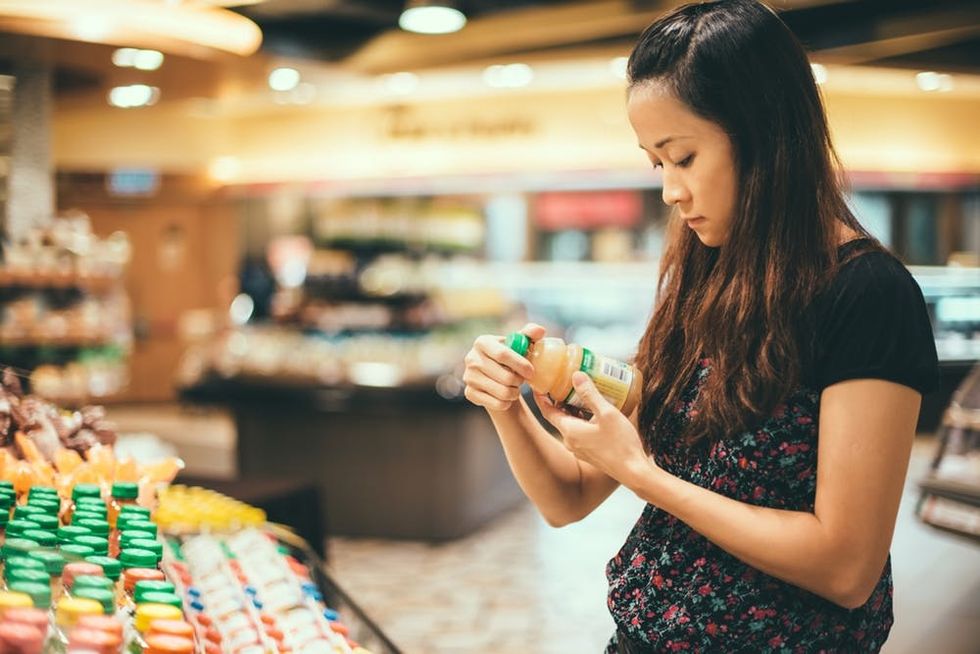 Woman reading nutrition label
