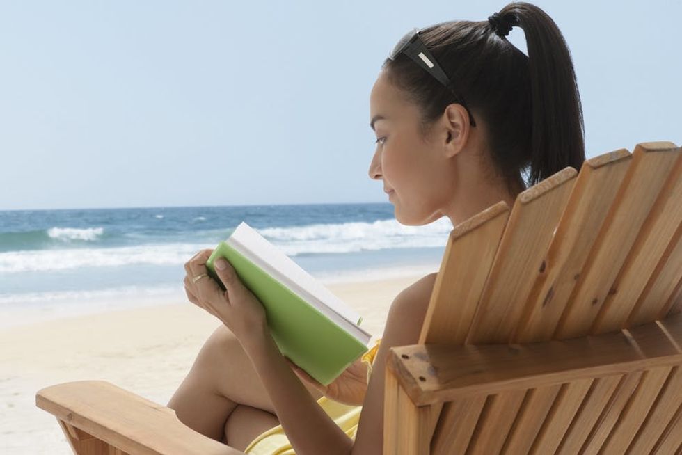 Woman reading on the beach