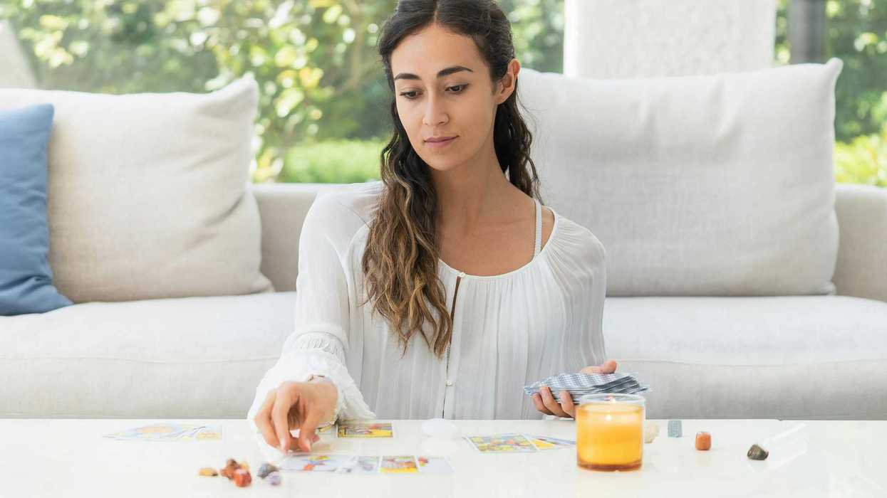 woman reading tarot cards - star tarot card meaning
