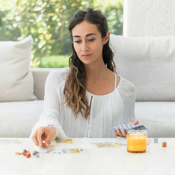 woman reading tarot cards - star tarot card meaning