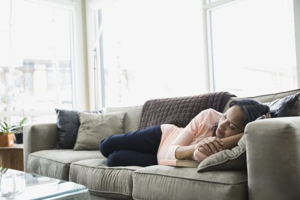 woman-sleeping-on-couch