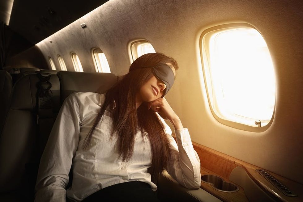 Woman sleeping on plane