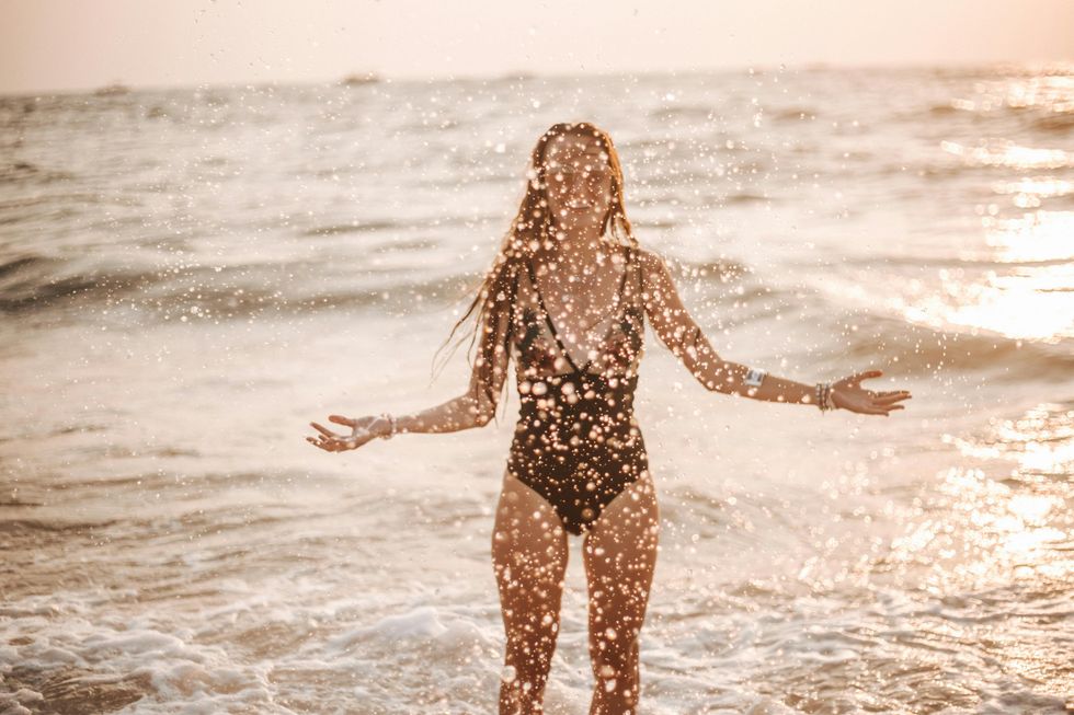 woman splashing at the beach