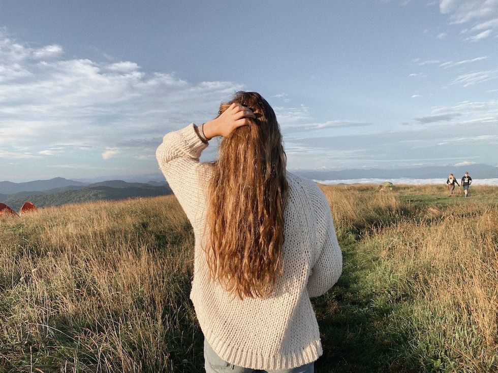 woman standing in a field