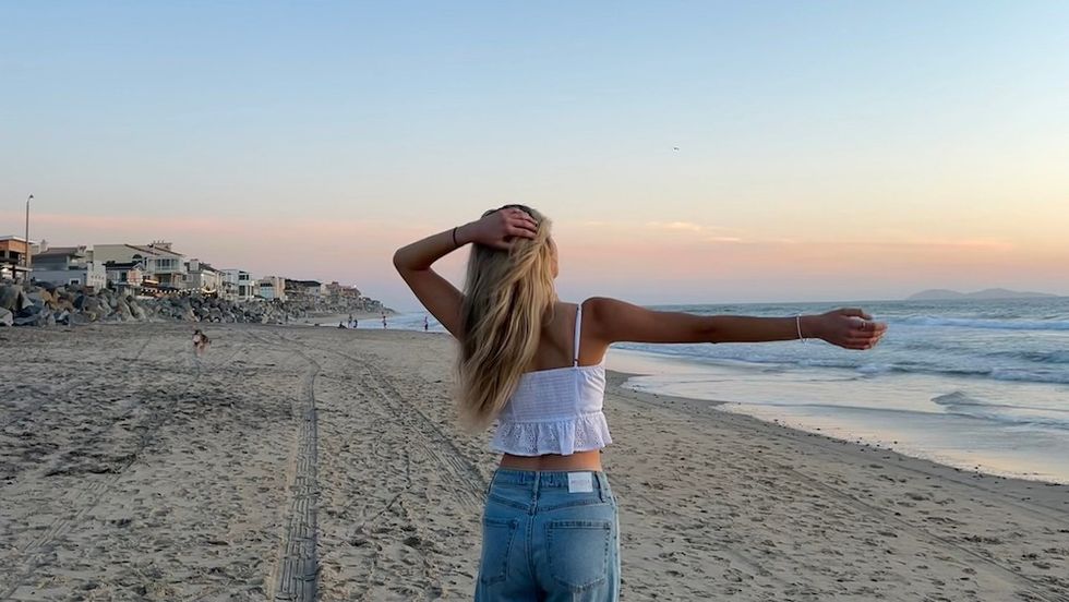woman standing on the beach