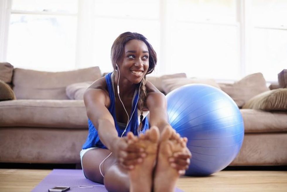 woman stretching home