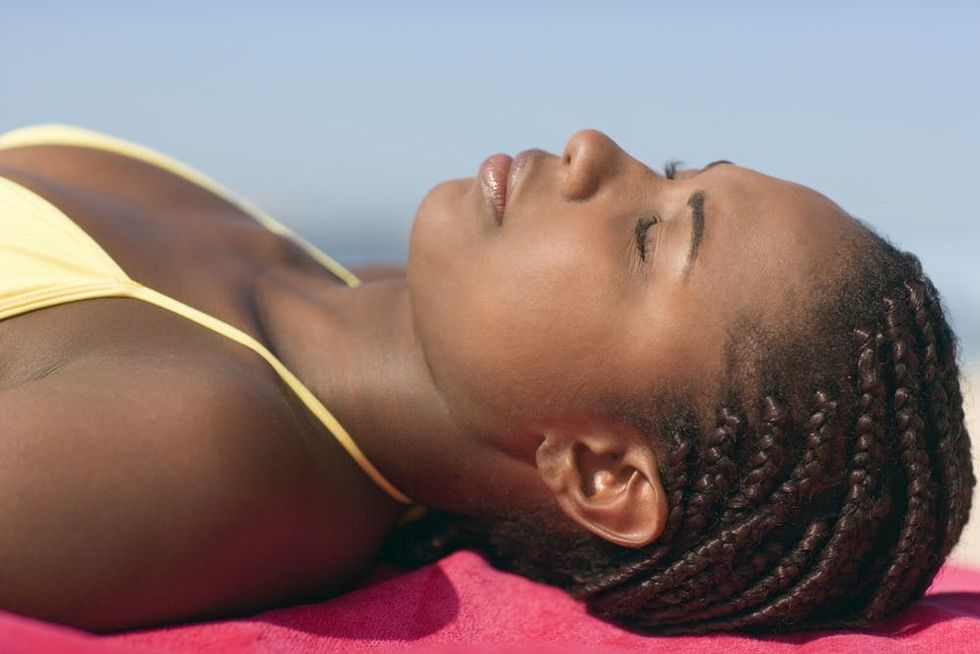 Woman sunbathing at beach