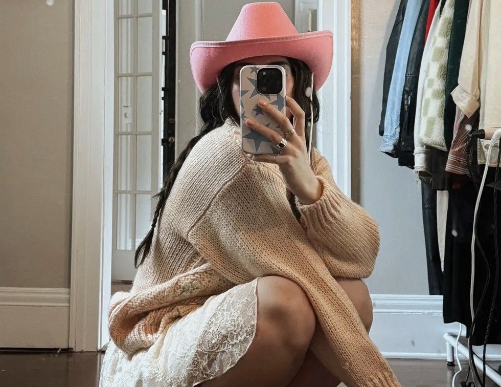 woman taking an outfit of the day selfie