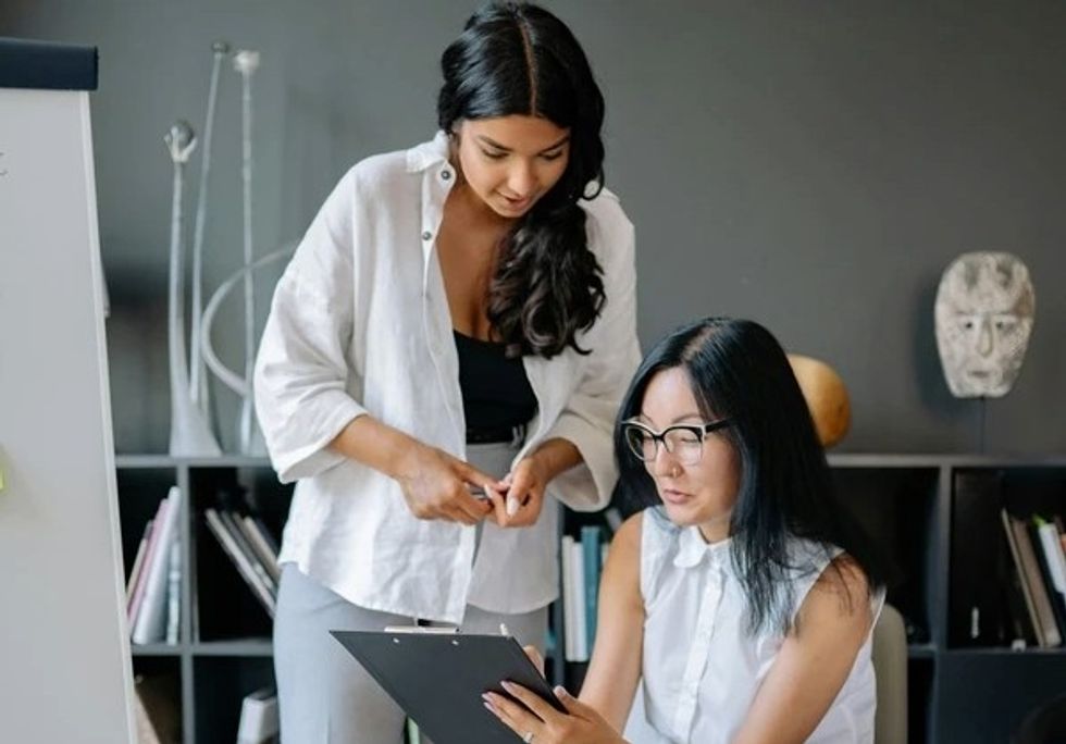 woman talking to boss at work