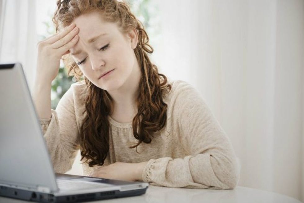 woman upset crying computer header Cropped