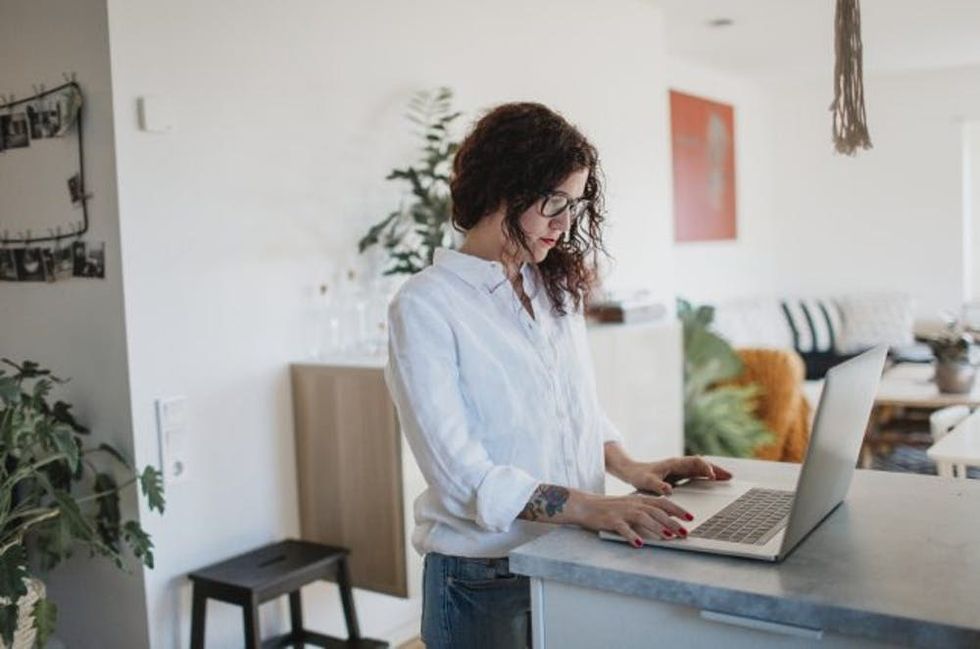 Woman using laptop at home