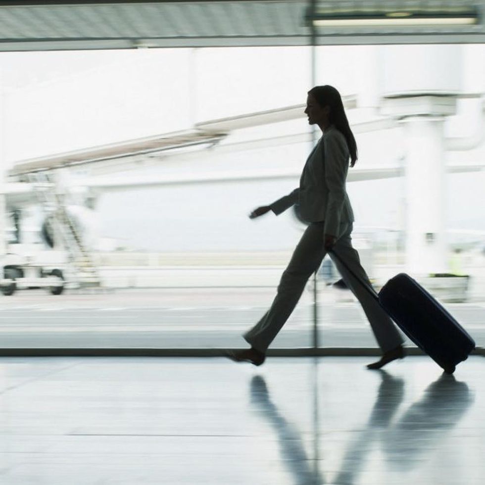 woman-walking-through-airport-square