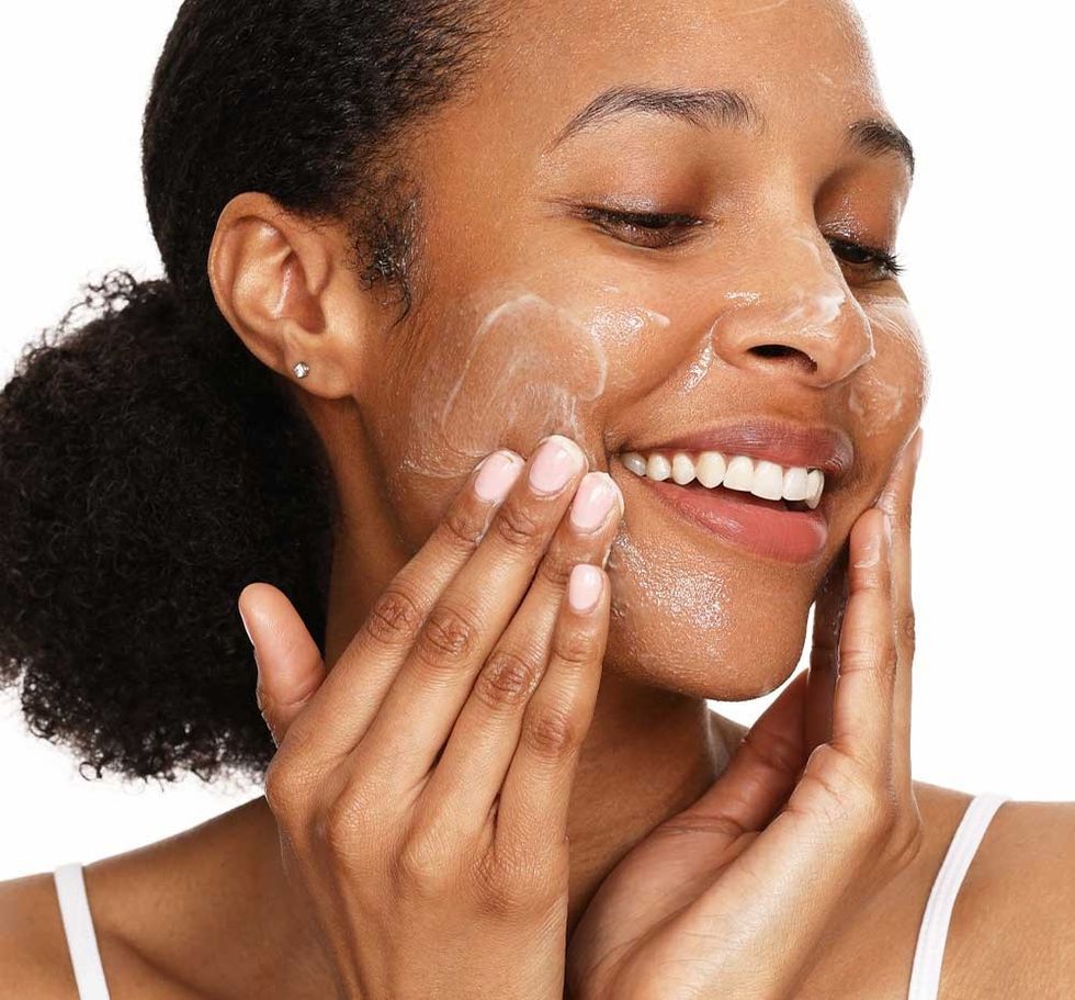 woman washing face with Farmhouse Make It Melt Cleanser
