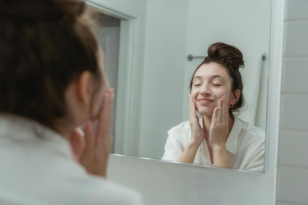 woman washing face