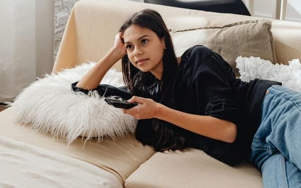 woman watching tv at home