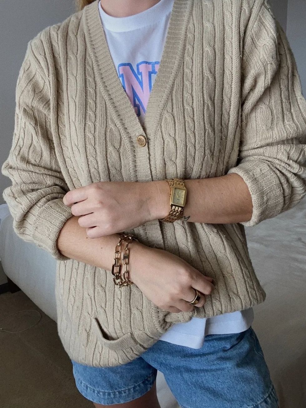 woman wearing a beige cardigan
