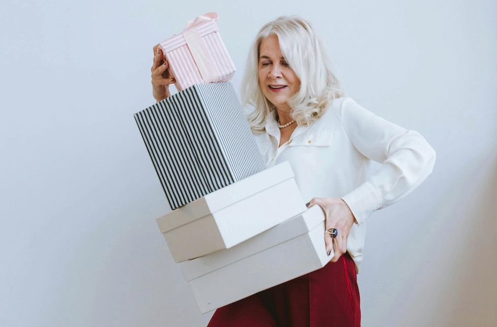 woman with a bunch of shopping boxes