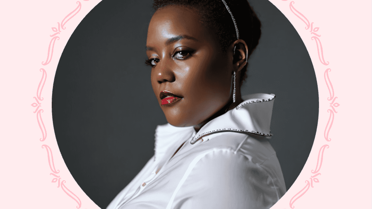 Woman with elegant updo and white blouse, framed by pink ornamental border.
