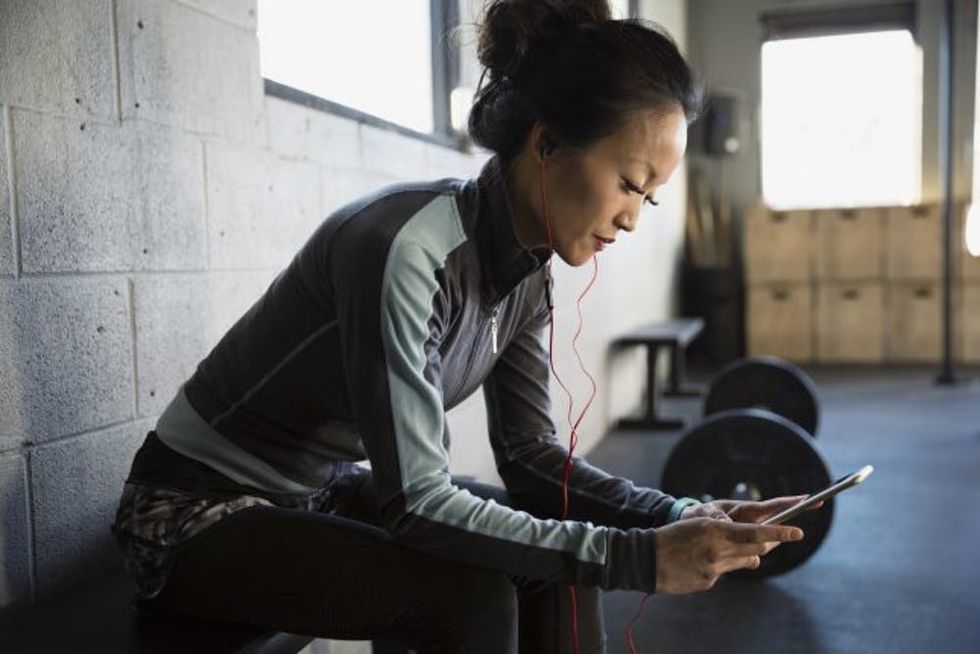 woman with headphones at gym