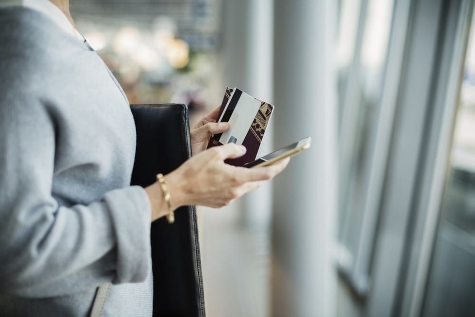 Woman with smartphone at airport