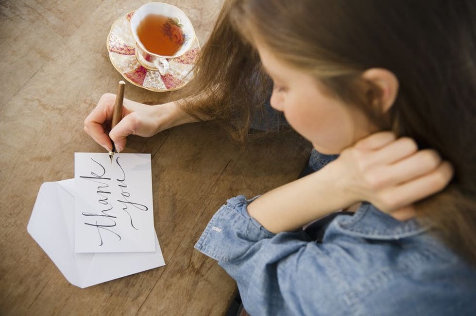 Woman writing greeting card