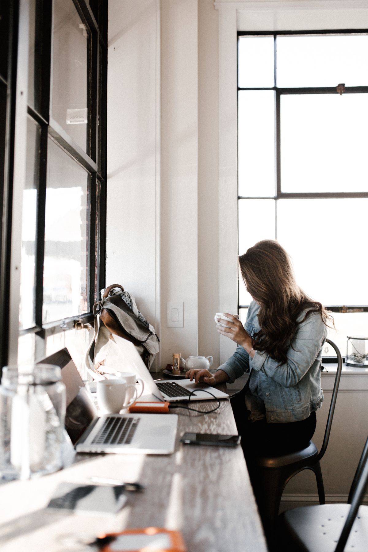 woman writing on laptop