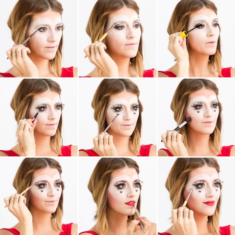 Women in red dress with brown hair applying Queen of Hearts makeup