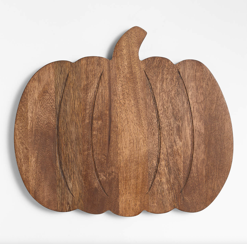 Wooden pumpkin-shaped cutting board with a smooth finish.