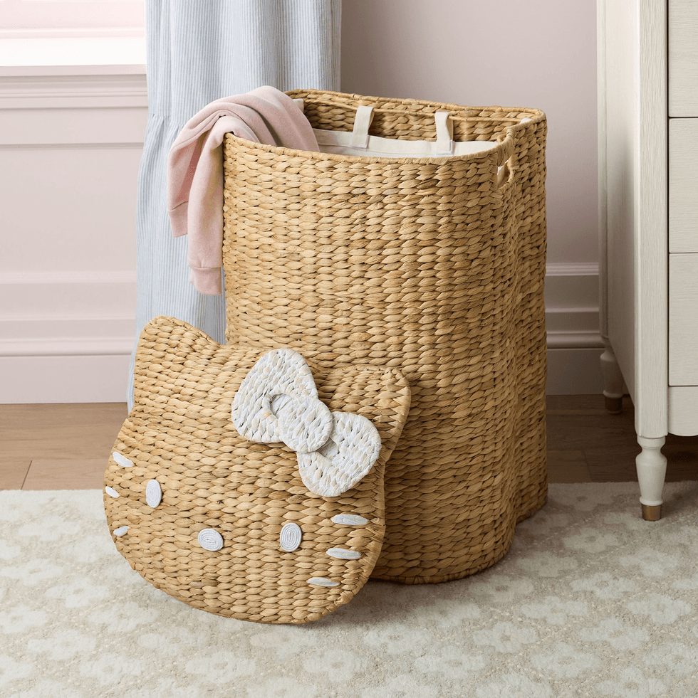 Woven basket with a Hello Kitty lid and pink cloth draped over the side.