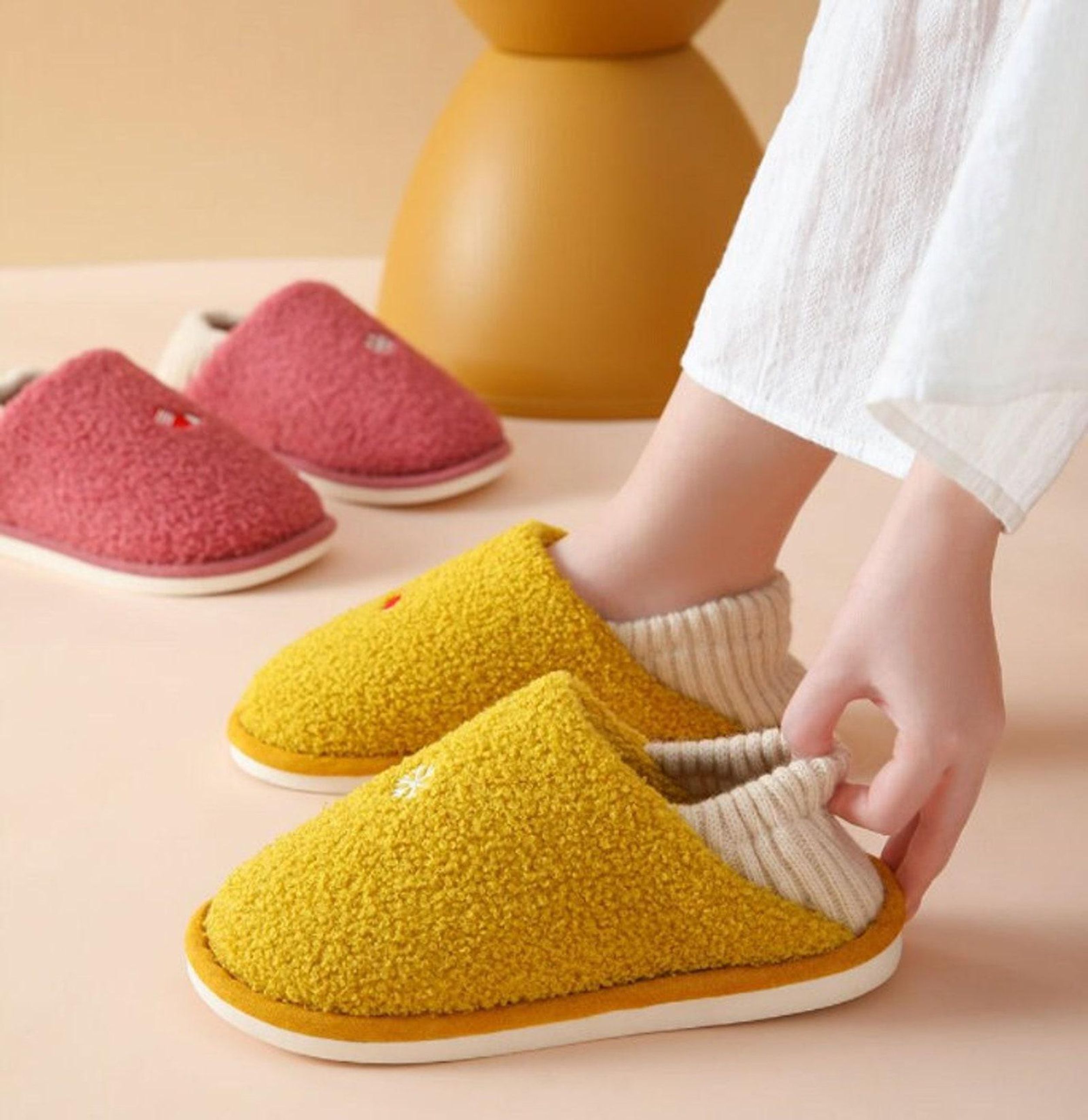 yellow and pink slippers with orange bottoms