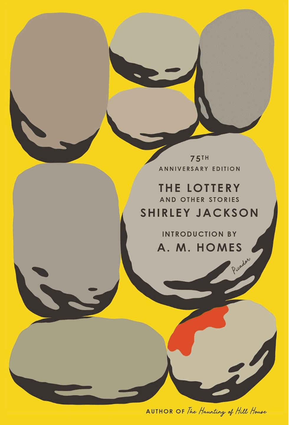 Yellow book cover with gray stones, one marked red. Title: "The Lottery" by Shirley Jackson.