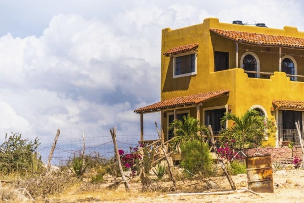 Yellow-concrete-home-facing-the-ocean-in-Mexico-000062080950_Medium