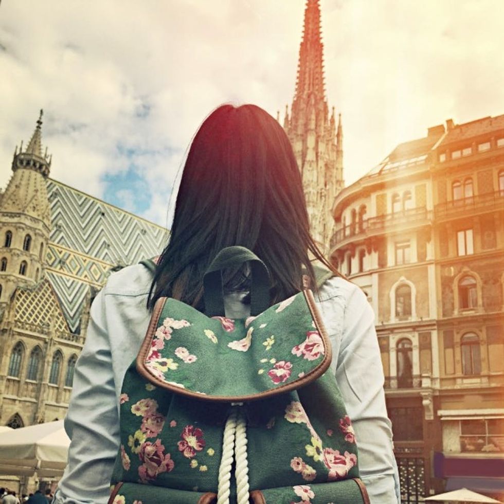 Young-girl-in-front-of-Stephansdom-Cathedral-in-Vienna-000064165447_Medium