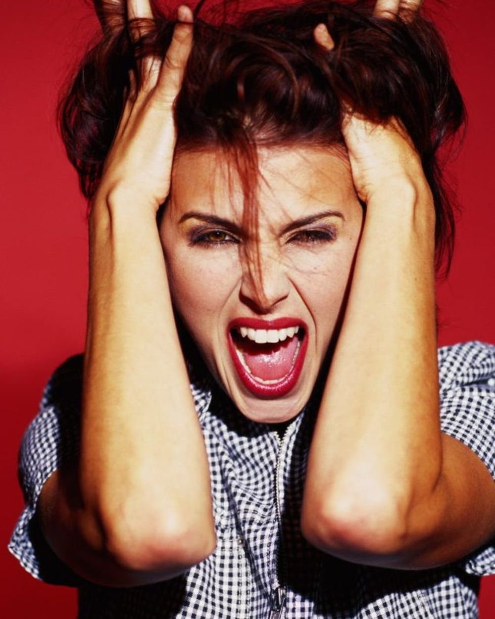 Young woman screaming, close-up